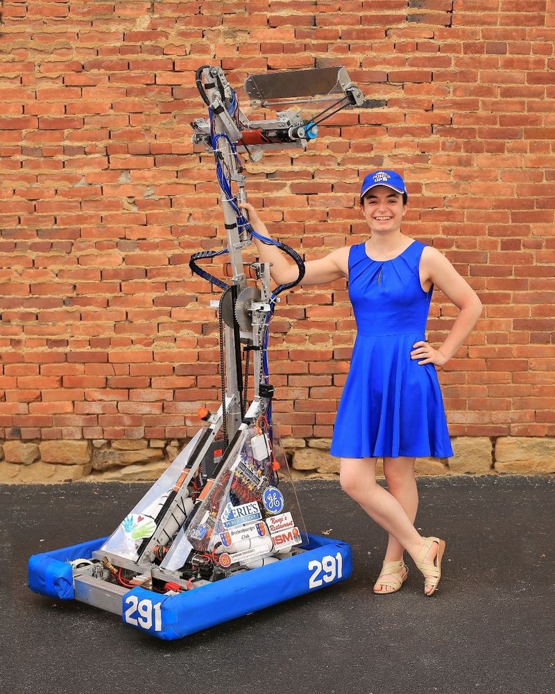 Penn State Behrend senior Julia Cecchetti stands next to a robotics project.