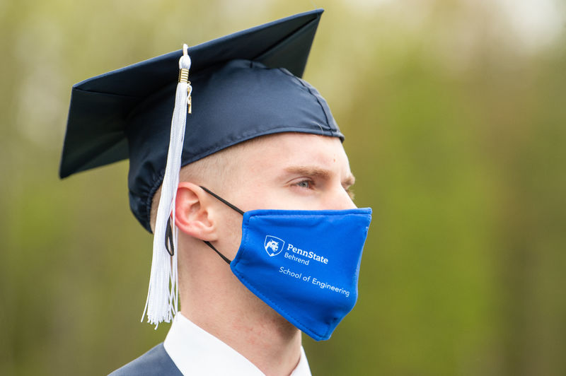 A close-up photo of a Penn State Behrend graduate at commencement.
