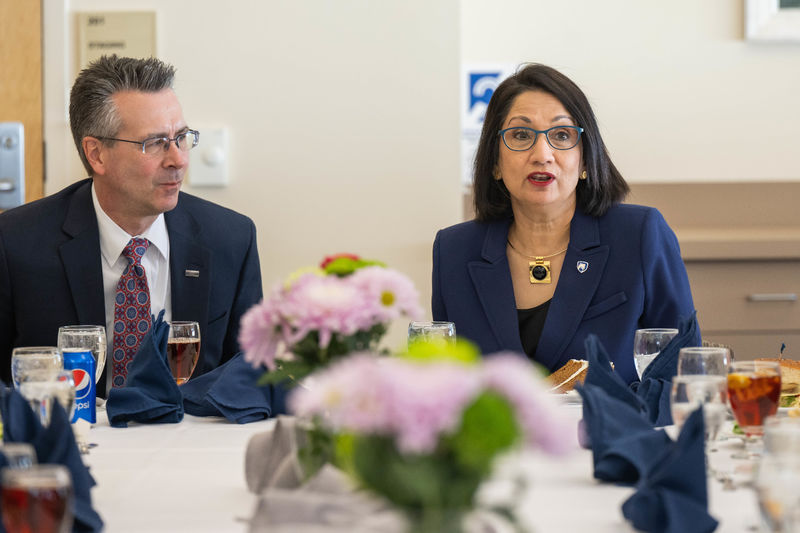 Penn State Behrend Chancellor Ralph Ford and Penn State President-elect Neeli Bendapudi talk at a luncheon with student leaders on March 29.