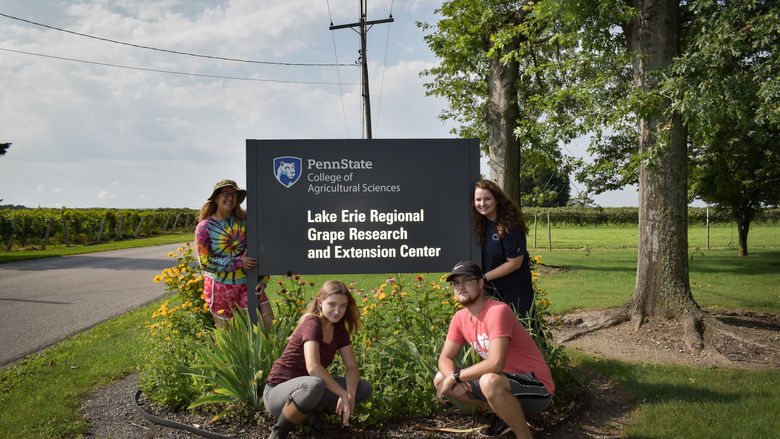 Lake Erie Regional Grape Research and Extension Center Sign with four research students
