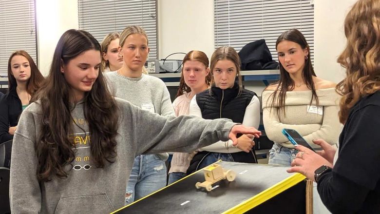 High-school girls test a model car during an engineering program at Penn State Behrend.