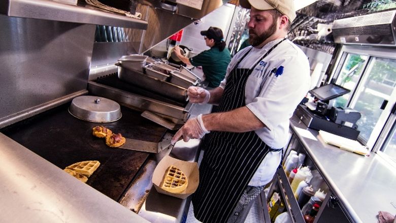 Chef James Nicosia works inside the Behrend Clipper food truck