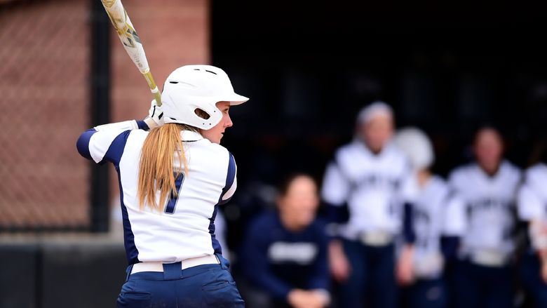 A Penn State Behrend softball player prepares to hit the ball.