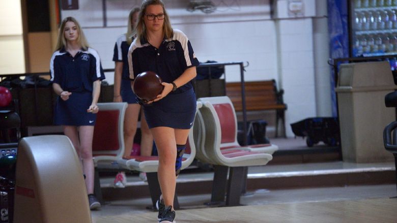 A Penn State Behrend bowler prepares to roll the ball.