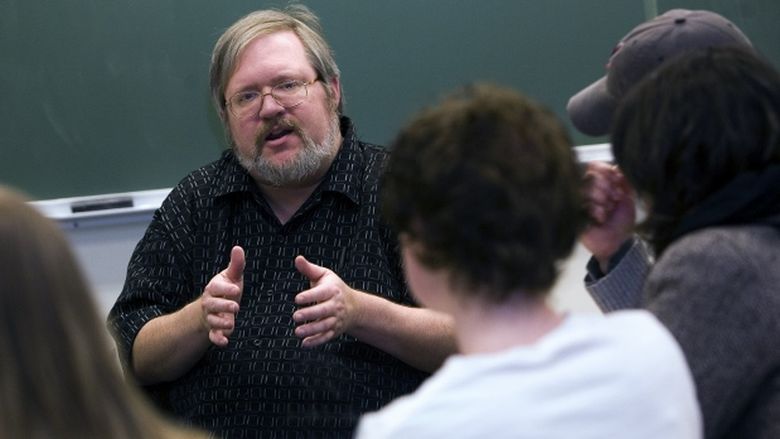 Penn State Behrend professor George Looney in a classroom with students.