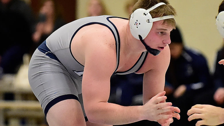 Penn State Behrend wrestler Jake Paulson competes in a match.