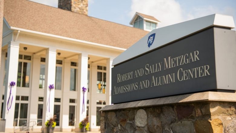 Purple ribbons hang on the pillars of Penn State Behrend's Metzgar Center.