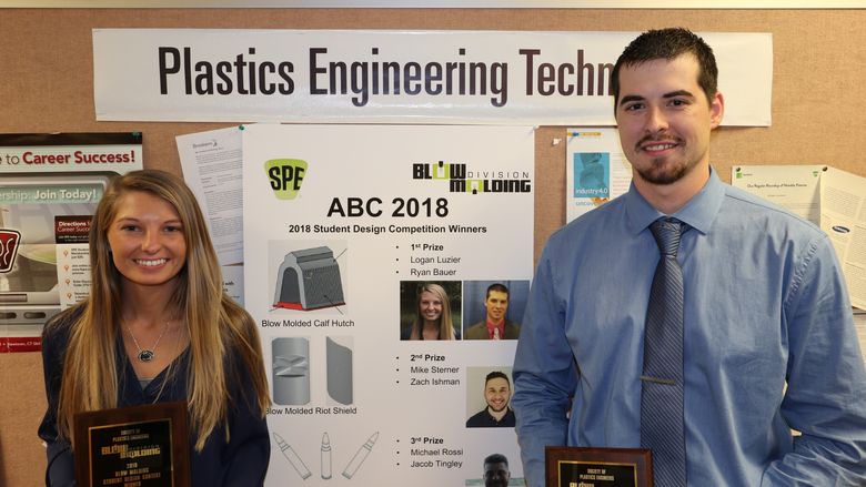 Penn State Behrend students Ryan Bauer, right, and Logan Luzier recently took first place in the Blow Molded Parts Competition at the 34th annual Blow Molding Conference, held earlier this semester in Pittsburgh.