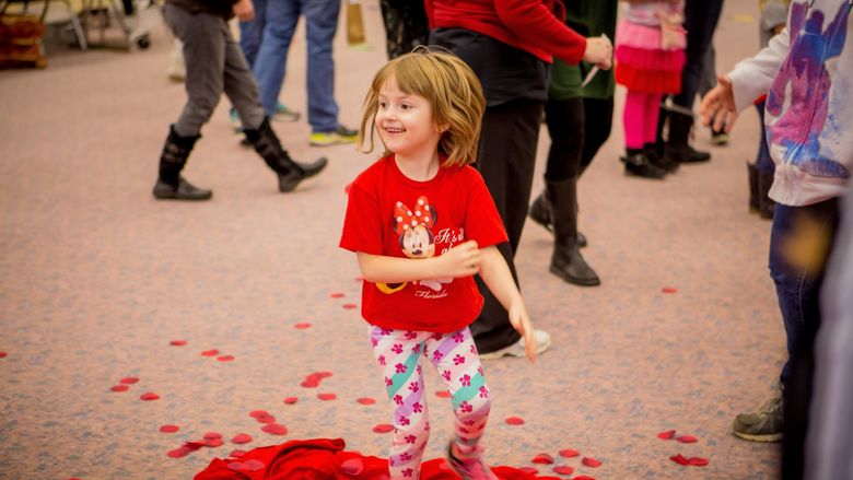A young participant enjoys the Hearts and Showers activity during the Valentine's Day Extravaganza, held Saturday, Feb. 10, at North East School District’s Earle C. Davis Primary school. 