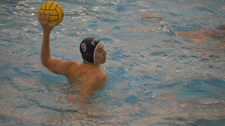 A Penn State Behrend water polo player prepares to throw the ball.