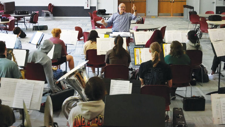 Dr. Gary Viebranz, teaching professor of music and director of instrumental ensembles, directs students in rehersal.