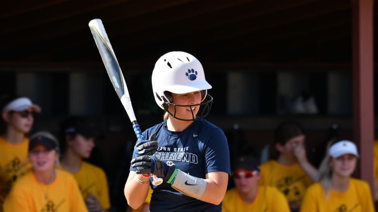 A Penn State Behrend softball player stands in the batter's box.