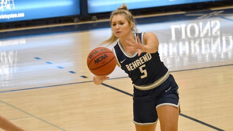Penn State Behrend basketball player Rachel Majewski passes the ball.