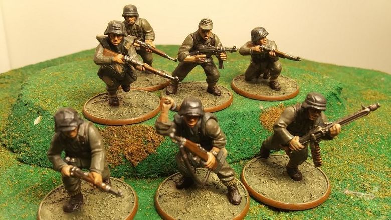 A close-up photo of a band of miniature soldiers.