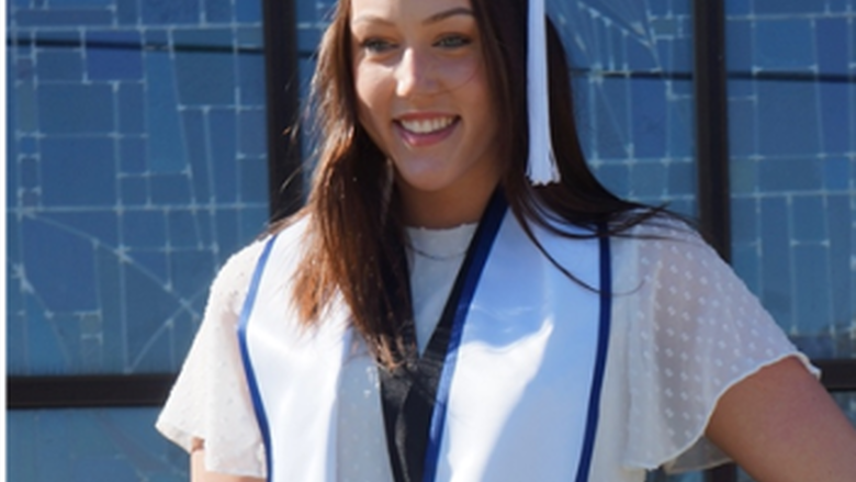 Photo of woman wearing graduation cap