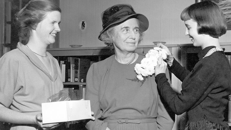 Mary Behrend receiving a corsage from Penn State Behrend students in the 1950s.