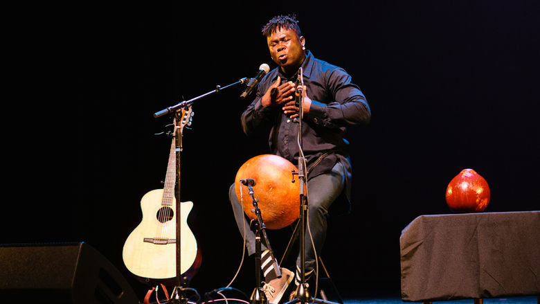 Okaidja Afroso performs during a concert.