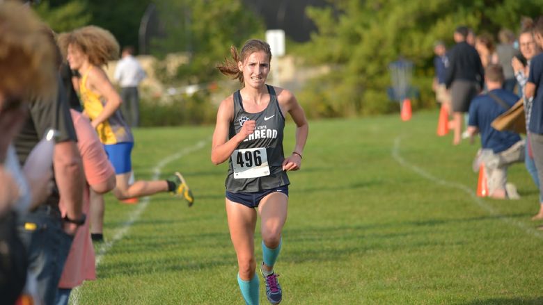 Penn State Behrend runner Savanna Carr competes in a cross country race.