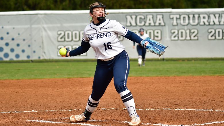 A pitcher for the Penn State Behrend softball team throws the ball.