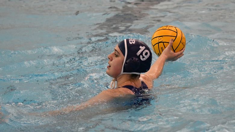 A Penn State Behrend water polo player prepares to throw the ball.