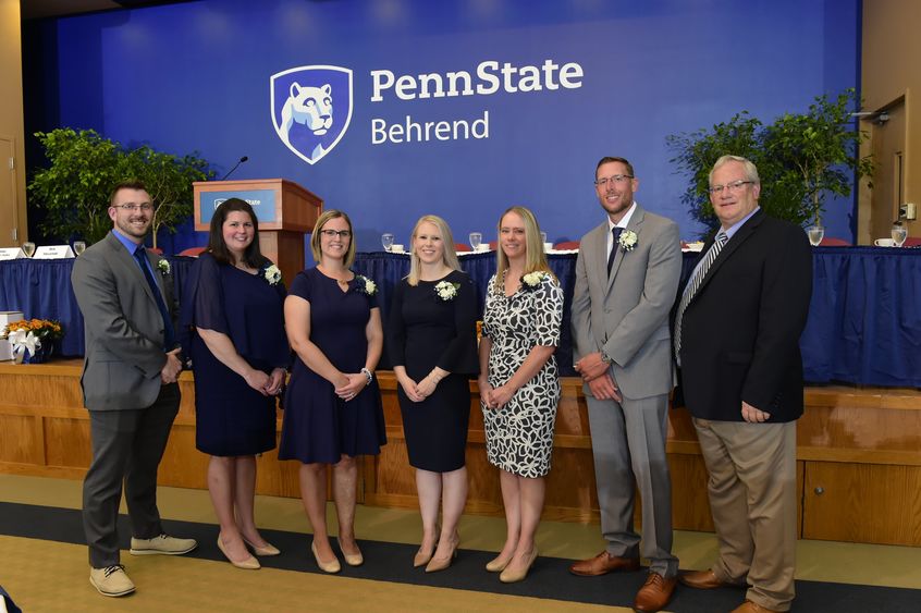 Six alumni members pose with Penn State Behrend Director of Athletics Brian Streeter.