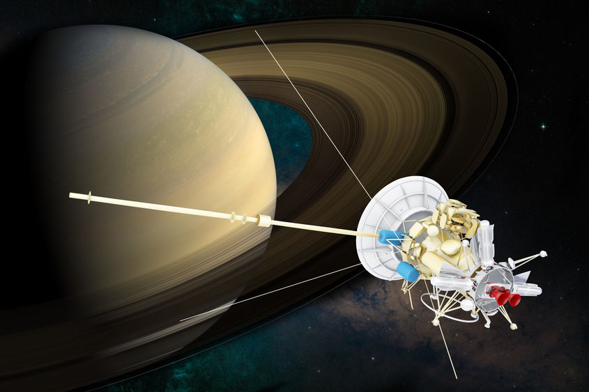 Cassini-Huygens spacecraft pictured next to Saturn.