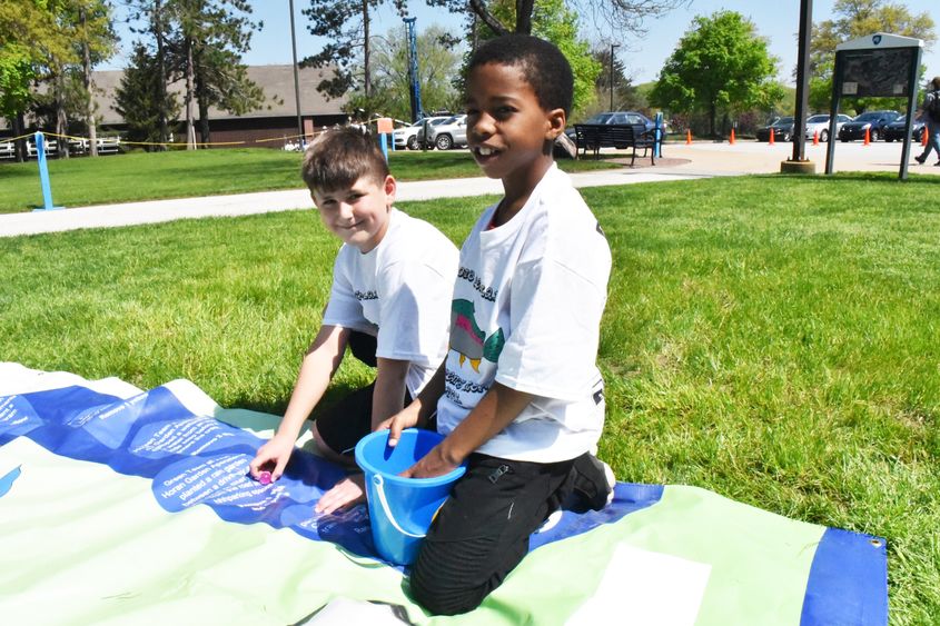 Amari Eaddy, right, and David Burdak participate in an Interactive Watershed Game at the Children's Water Festival, held May 17 at Penn State Behrend.