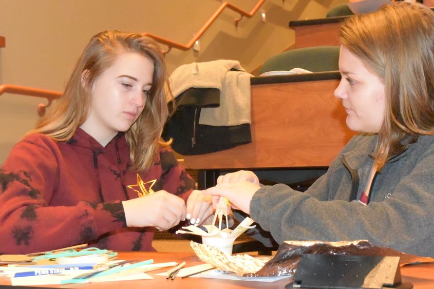 Ani Entrekin, left, and Maygan Stoddard work to create a dome during the Inspiring Bright Futures program, held May 22 at Penn State Behrend.