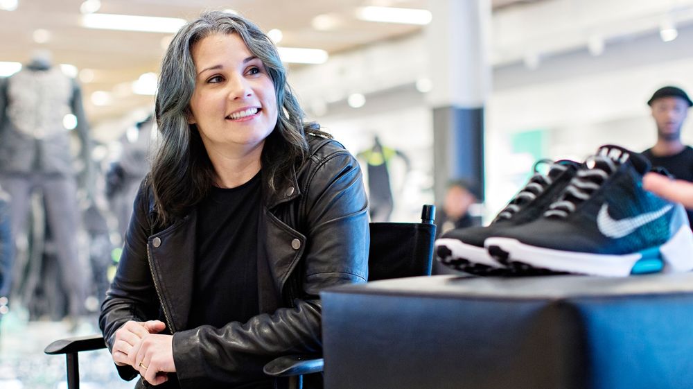Tiffany Beers, a senior innovator at Nike, poses with the company's HyperAdapt 1.0 shoes.