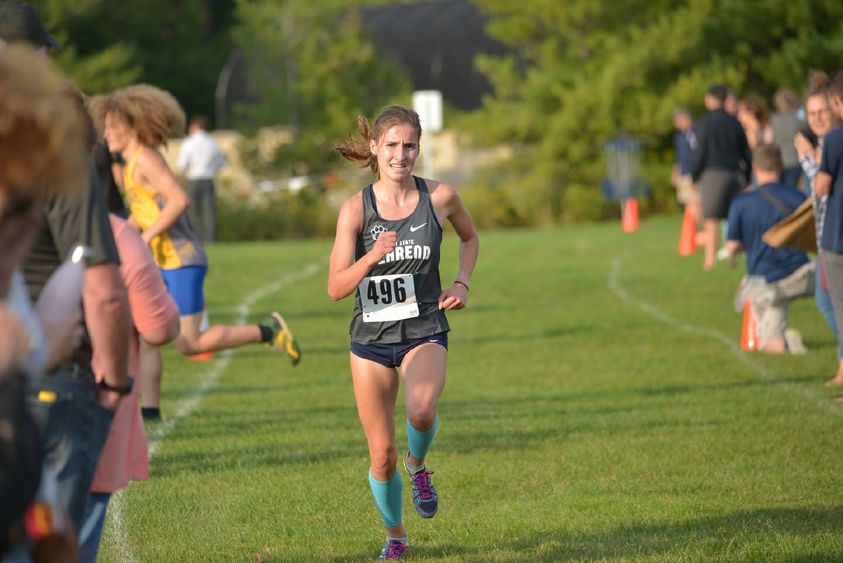 Penn State Behrend runner Savanna Carr competes in a cross country race.