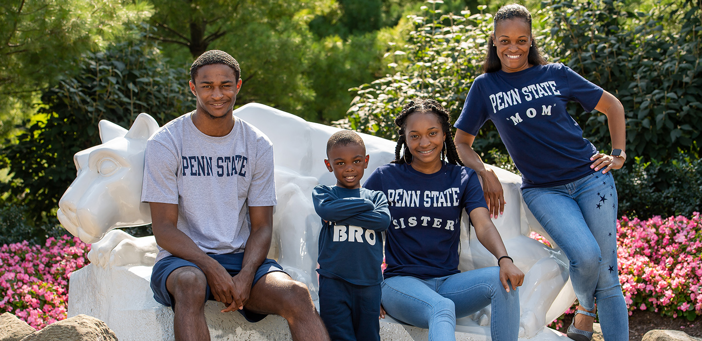 A family posing near Behrend's lion shrine