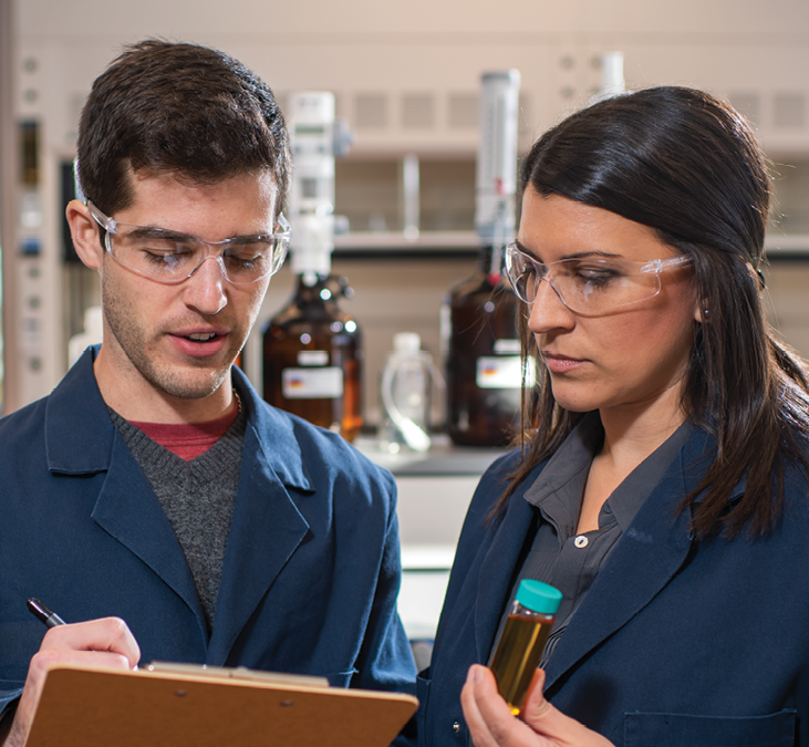 A male and a female student work in a laboratory