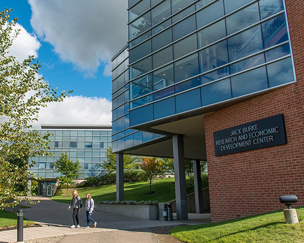 Students walk near Burke Center at Penn State Behrend.