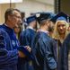 Penn State Behrend Chancellor Ralph Ford talks with students prior to the college's spring 2022 commencement program.