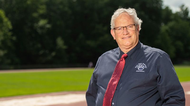 Brian Streeter Brian Streeter, senior director of athletics, stands at the Penn State Behrend track.