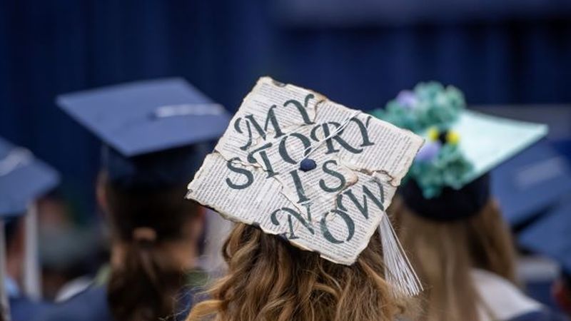 A decorated mortarboard cap during a Penn State Behrend commencement.
