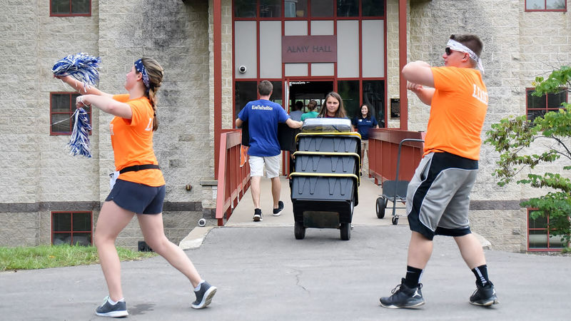 Two students dance during move-in day at Penn State Behrend