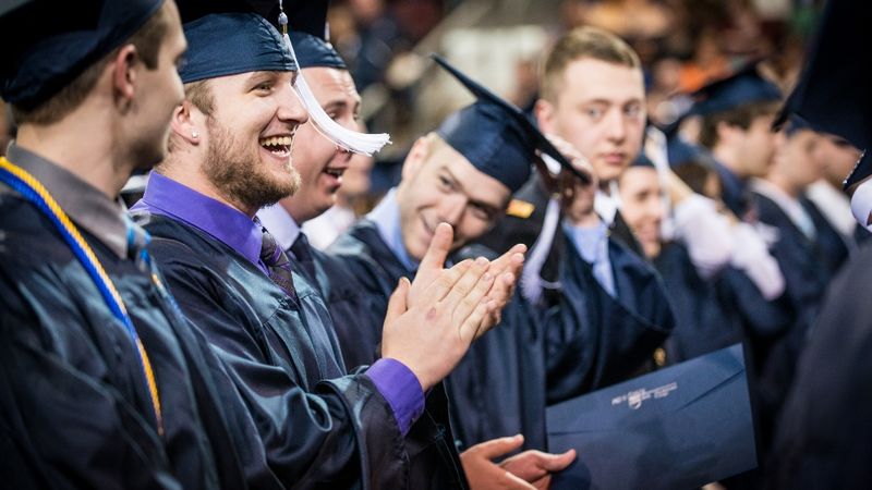 Students sit in rows at Penn State Behrend's spring commencement.