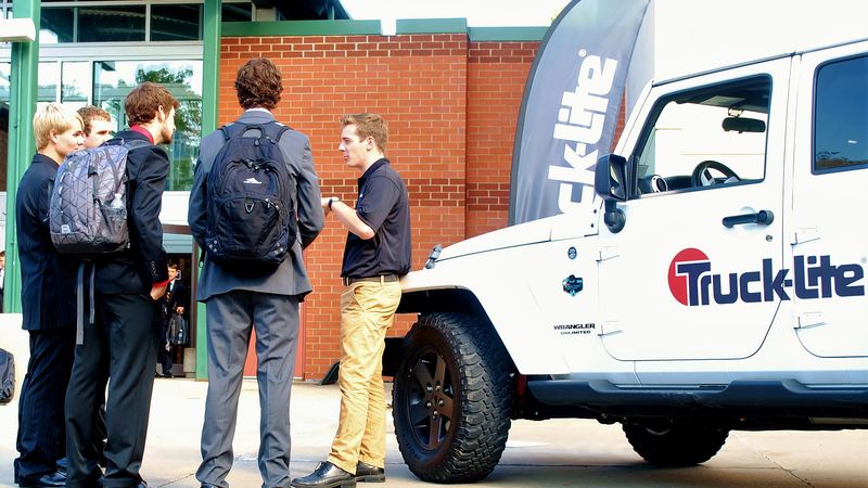 A corporate recruiter talks with students at the Penn State Behrend career fair.