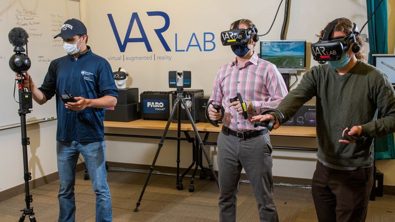 Students and faculty members experiment with augmented and virtual reality headsets in Penn State Behrend's VAR Lab.