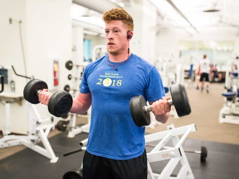 A male student works out at Penn State Behrend's Junker Center.