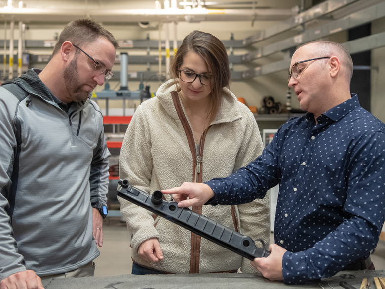 PTA Instructor Jason Williams goes over a part with course attendees.