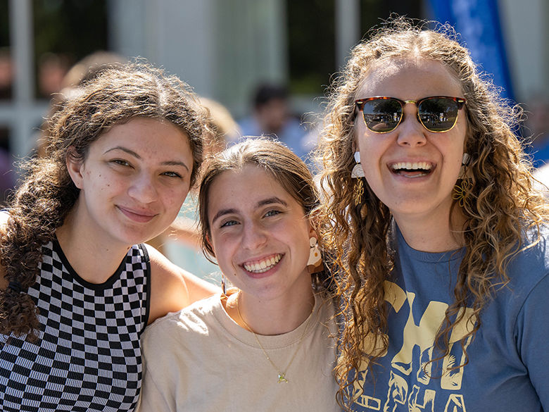 Three female students pose for a photo
