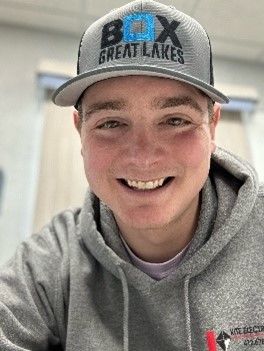 Man in gray hoodie with gray ballcap