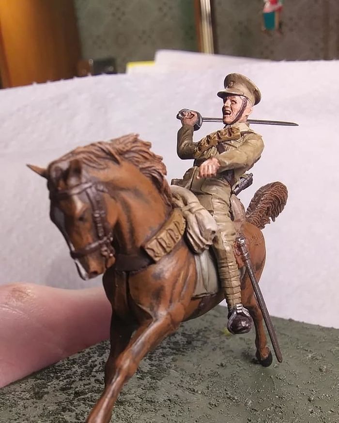 A detail of a miniature figure of a soldier on a horse.