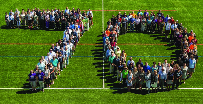 e of the college’s faculty, staff, and students gathered on the soccer field last summer to mark Behrend’s big birthday with this family portrait.