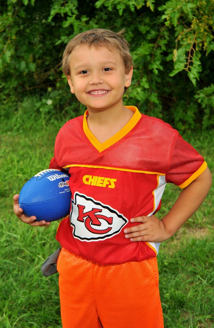 Jakob Cole poses with a football.