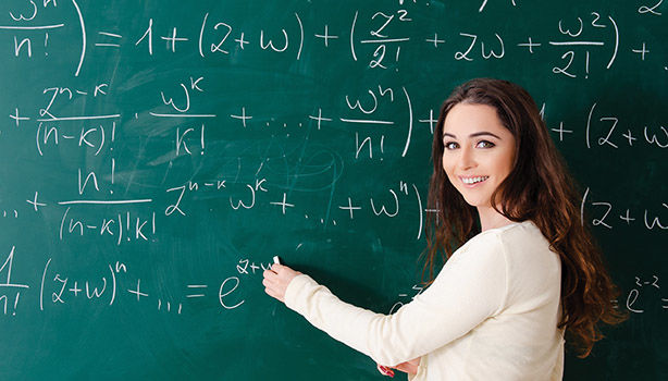Girl doing math on a chalkboard