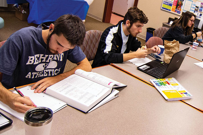 Commuter students studying at a table