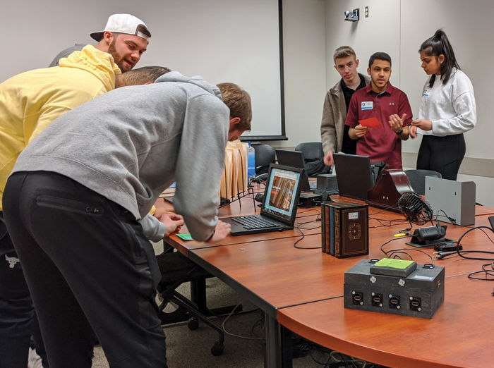Students participate in a cybersecurity escape room activity, hosted by U.S. Steel executives, in the fall of 2019.